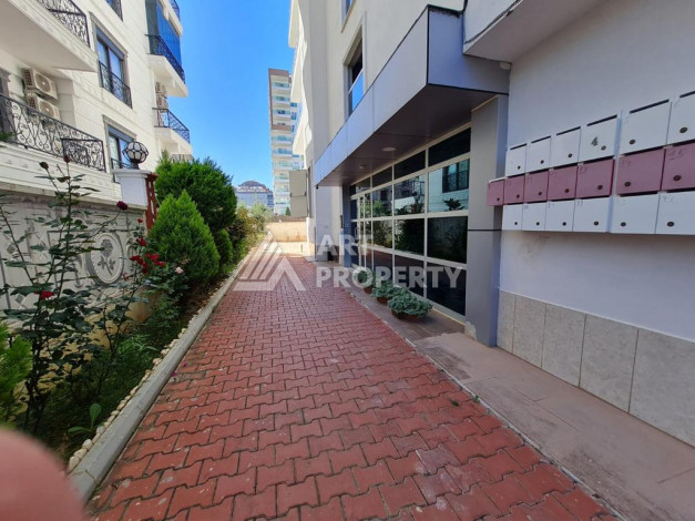 Меблированная квартира планировки 1+1 с большой площадью 70м2, район Махмутлар - Ракурс 14