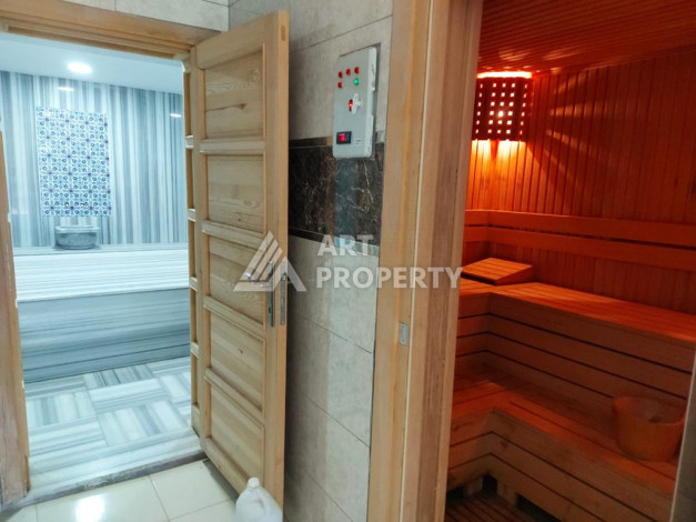 Меблированная квартира планировки 1+1 с большой площадью 70м2, район Махмутлар - Ракурс 19