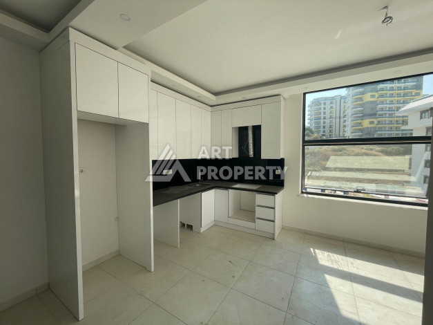 Апартаменты планировки 1+1, 57м2 в районе Махмутлар - Ракурс 14