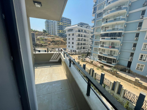 Апартаменты планировки 1+1, 57м2 в районе Махмутлар - Ракурс 16