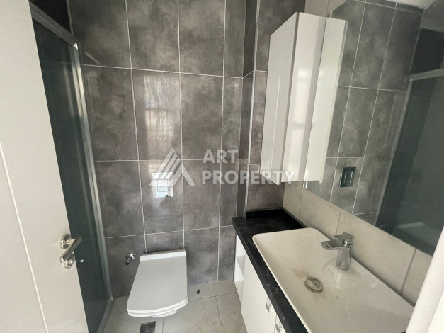 Апартаменты планировки 1+1, 57м2 в районе Махмутлар - Ракурс 23