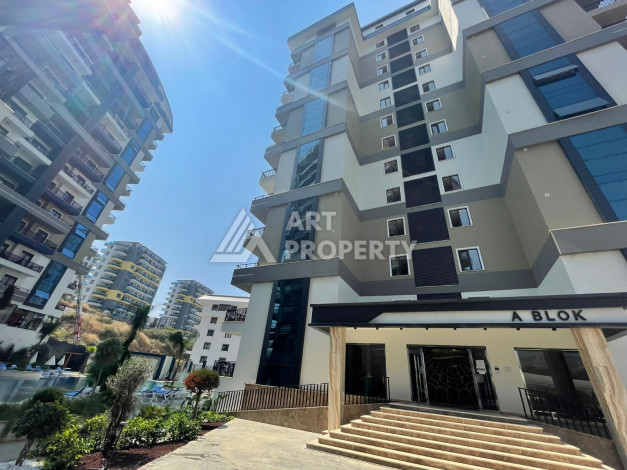 Меблированная квартира в современном жилом комплексе с планировкой 1+1 в районе Махмутлар, 56м2 - Ракурс 2