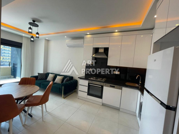 Меблированная квартира в современном жилом комплексе с планировкой 1+1 в районе Махмутлар, 56м2 - Ракурс 3