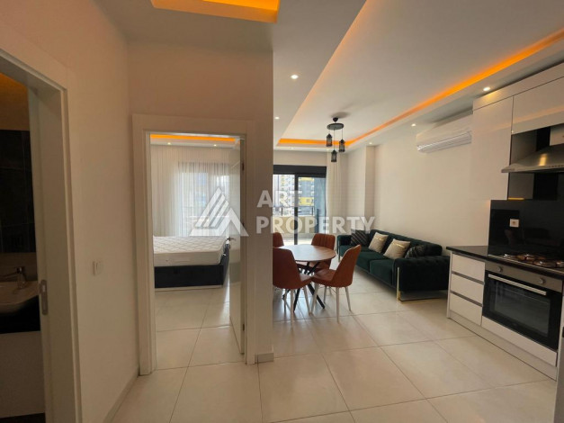 Меблированная квартира в современном жилом комплексе с планировкой 1+1 в районе Махмутлар, 56м2 - Ракурс 4