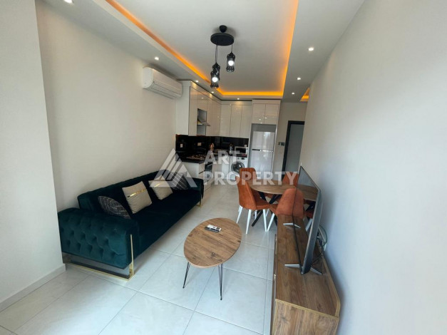 Меблированная квартира в современном жилом комплексе с планировкой 1+1 в районе Махмутлар, 56м2 - Ракурс 6