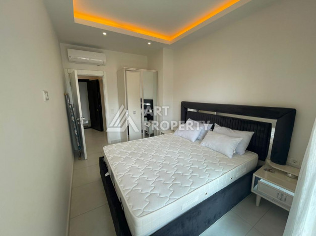 Меблированная квартира в современном жилом комплексе с планировкой 1+1 в районе Махмутлар, 56м2 - Ракурс 7