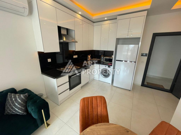 Меблированная квартира в современном жилом комплексе с планировкой 1+1 в районе Махмутлар, 56м2 - Ракурс 9