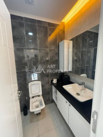 Меблированная квартира в современном жилом комплексе с планировкой 1+1 в районе Махмутлар, 56м2 - Ракурс 11