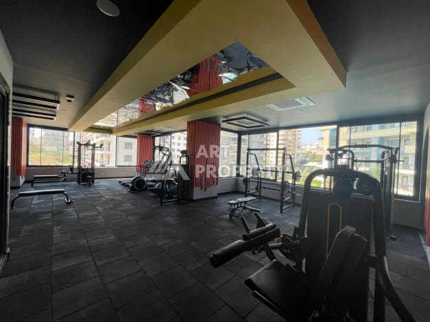 Меблированная квартира в современном жилом комплексе с планировкой 1+1 в районе Махмутлар, 56м2 - Ракурс 16