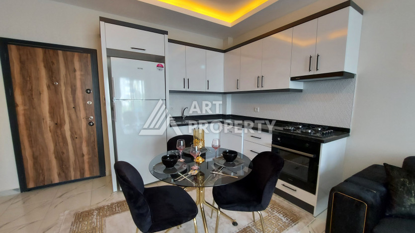 Меблированная квартира в новом доме в районе Махмутлар с планировкой 1+1, 5м2 - Ракурс 4