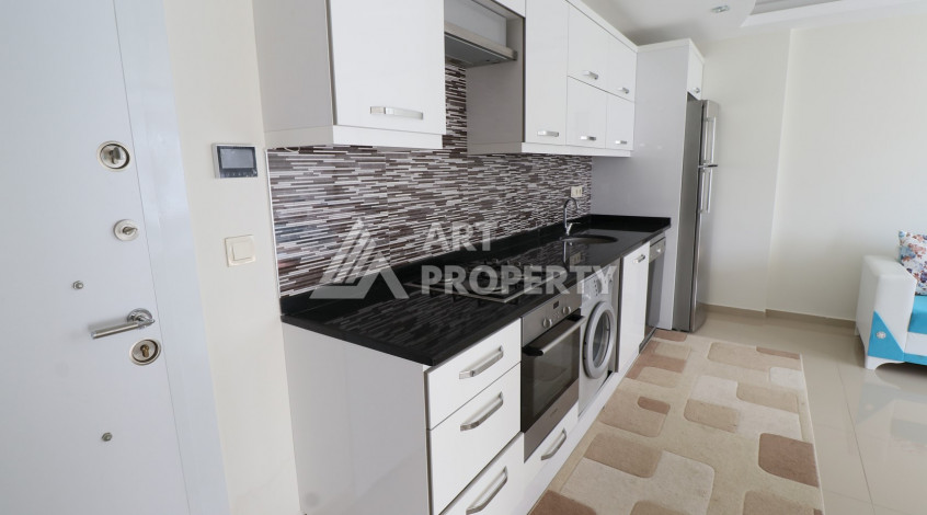 Квартира планировки 1+1 в курортном районе Махмутлар ,65м2 - Ракурс 2