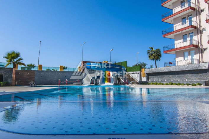 Апартаменты на первой береговой линии в великолепном комплексе в районе Махмутлар, 2+1, 90м2 - Ракурс 2