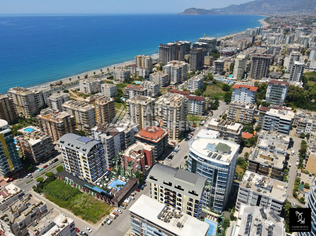 Инвестиционный проект с выгодной локацией в центре района Махмутлар! - Ракурс 6