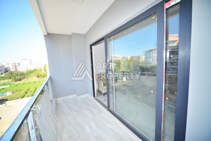 Апартаменты в курортном районе Махмутлар планировки 1+1, 60м2 - Ракурс 12