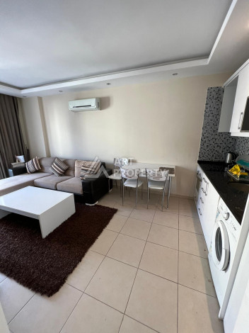 Просторные апартаменты с мебелью в районе Махмутлар планировки 1+1, 65м2 - Ракурс 6