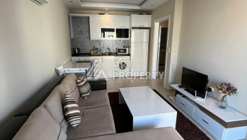 Просторные апартаменты с мебелью в районе Махмутлар планировки 1+1, 65м2 - Ракурс 12