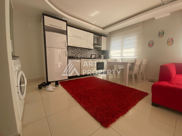 Апартаменты в жилом комплексе с развитой инфраструктурой в районе Махмутлар, планировка 1+1 - Ракурс 2