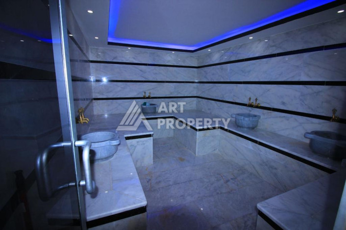 Апартаменты в комплексе с развитой инфраструктурой планировки 1+1 в районе Махмутлар, 65м2 - Ракурс 2