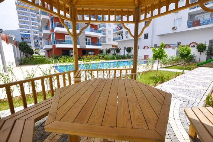 Апартаменты в комплексе с развитой инфраструктурой планировки 1+1 в районе Махмутлар, 65м2 - Ракурс 8