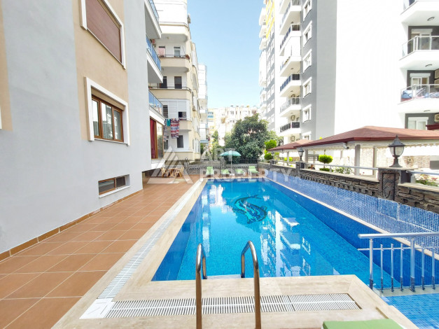 Меблированные апартаменты в курортном районе Махмутлар планировки 1+1, 65м2 - Ракурс 1