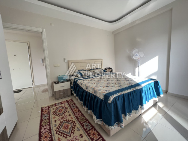 Меблированные апартаменты в курортном районе Махмутлар планировки 1+1, 65м2 - Ракурс 10