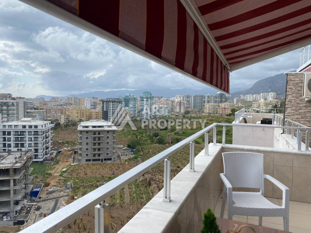 Квартира с шикарной террасой и видом на город и море в районе Махмутлар планировки 2+1, 110м2 - Ракурс 12