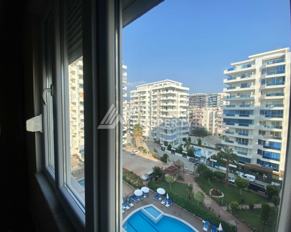 Квартира 1+1 в районе Махмутлар, всего в 200 метрах от моря - Ракурс 2