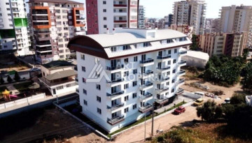 Апартаменты в жилом комплексе с прекрасной инфраструктурой в районе Махмутлар планировки 1+1, 47м2 - Ракурс 2