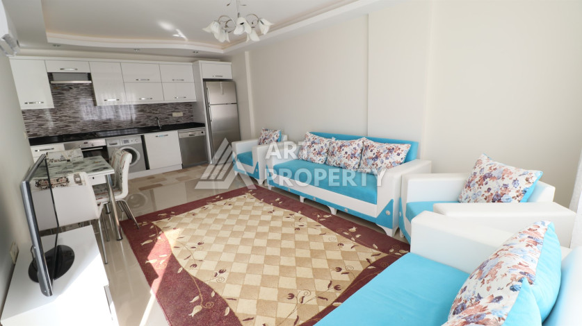 Квартира 1+1 в районе Махмутлар, всего в 300 метрах от моря - Ракурс 3