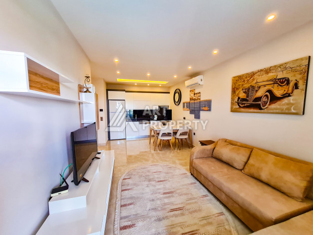 Меблированные апартаменты в комплексе с богатой инфраструктурой в районе Махмутлар, 65м2 - Ракурс 6