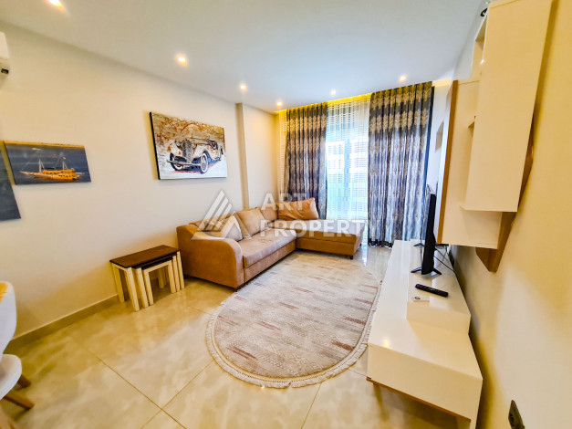 Меблированные апартаменты в комплексе с богатой инфраструктурой в районе Махмутлар, 65м2 - Ракурс 9