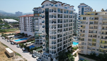 Апартаменты в шикарном комплексе планировки 1+1 в районе Махмутлар, 60м2 - Ракурс 3