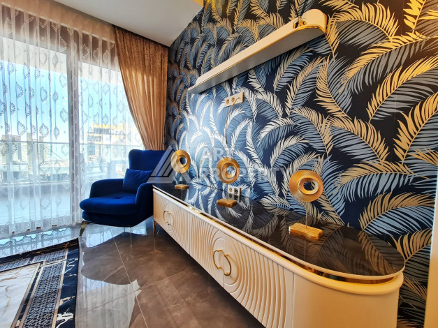 Меблированная квартира планировки 1+1, 65м2, в 150 метрах от моря, в районе Махмутлар - Ракурс 3