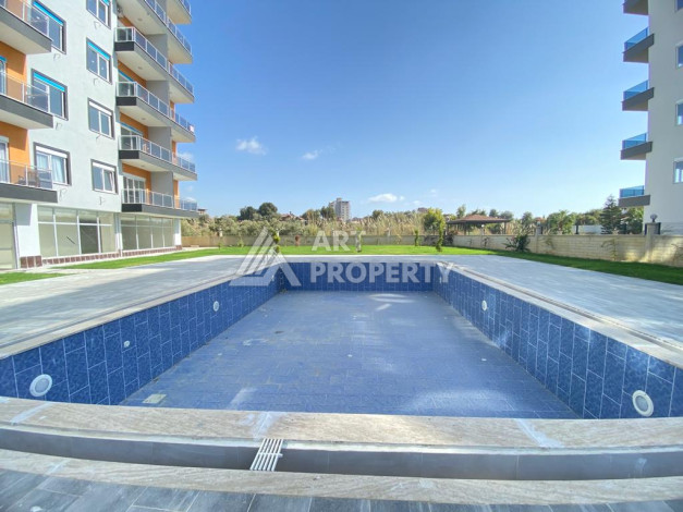 Апартаменты в жилом комплексе с просторной территорией в районе Авсаллар планировки 1+1,55м2 - Ракурс 2