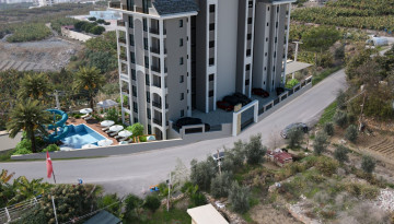Новый жилой комплекс в Махмутлар со своим собственным пляжем, 60-110 м2 - Ракурс 7
