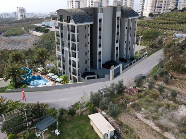 Новый жилой комплекс в Махмутлар со своим собственным пляжем, 60-110 м2 - Ракурс 6