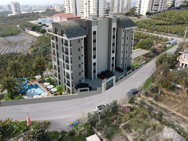 Новый жилой комплекс в Махмутлар со своим собственным пляжем, 60-110 м2 - Ракурс 8