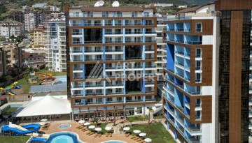 Просторные апартаменты в шикарном комплексе в районе Джикджилли, планировка 1+1, 77м2 - Ракурс 1