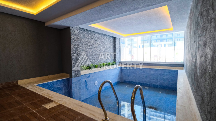 Квартира планировки 1+1 в комплексе с развитой инфраструктурой в районе Махмутлар, 55м2 - Ракурс 27