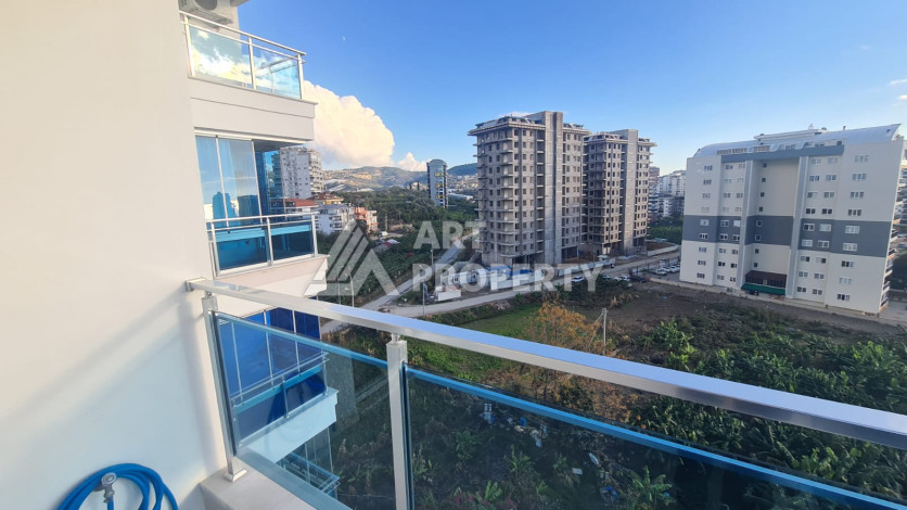 Меблированная квартира планировки 1+1 в районе Махмутлар, 70м2 - Ракурс 2