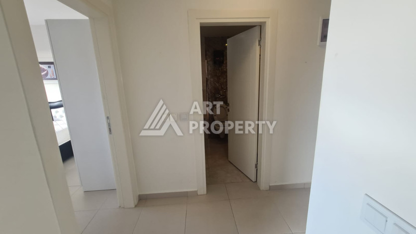 Меблированная квартира планировки 1+1 в районе Махмутлар, 70м2 - Ракурс 3