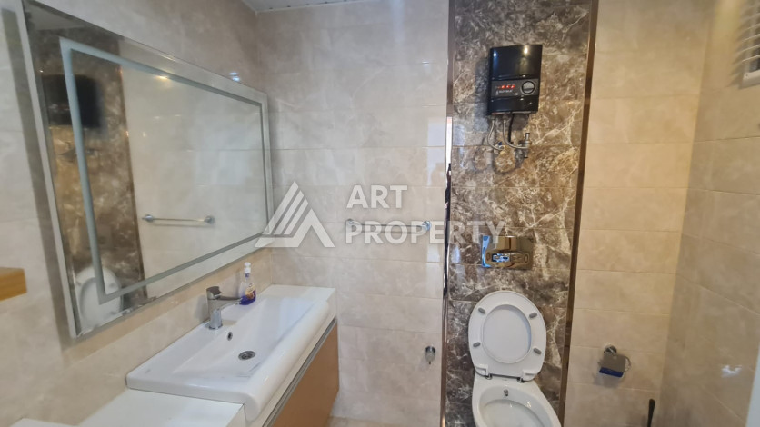 Меблированная квартира планировки 1+1 в районе Махмутлар, 70м2 - Ракурс 22