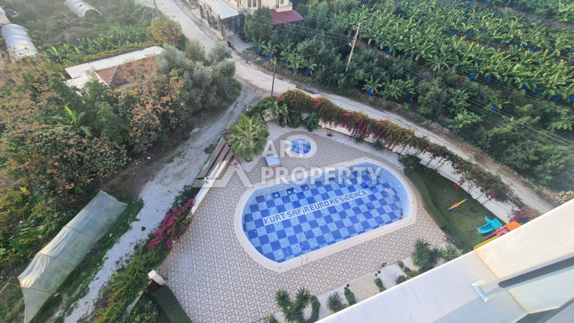 Меблированная квартира планировки 1+1 в районе Махмутлар, 70м2 - Ракурс 32