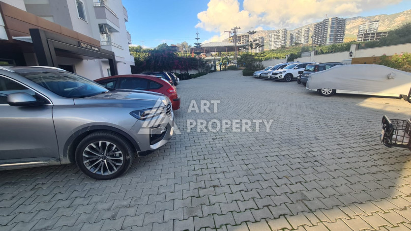 Меблированная квартира планировки 1+1 в районе Махмутлар, 70м2 - Ракурс 40