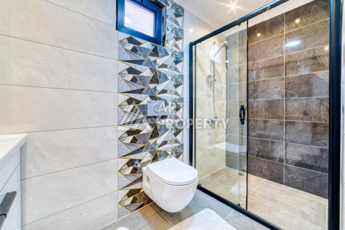 Шикарные апартаменты планировки 1+1 в районе Махмутлар, 55м2 - Ракурс 10