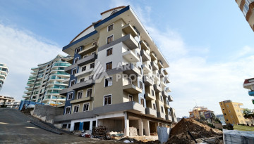 Квартира 1+1, 50м2, в доме на финальной стадии строительства, в районе Махмутлар, в 600 метрах от моря. - Ракурс 6