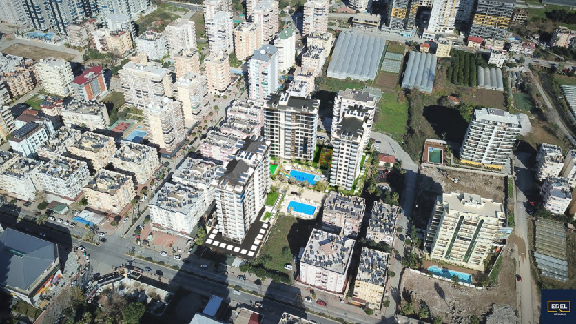 Инвестиционный проект в Махмутларе на центральной улице Барбарос в 150 м от моря, 85-168 м2 - Ракурс 22