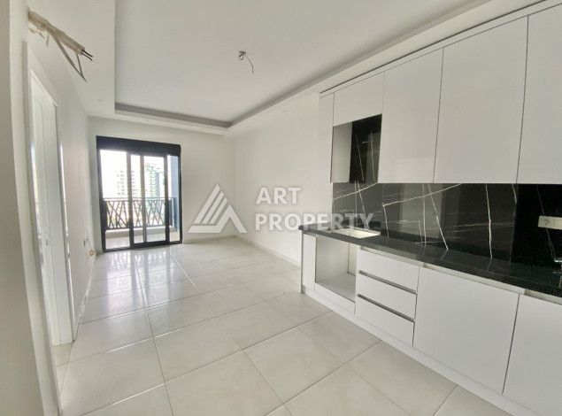 Квартира в новом комплексе с развитой инфраструктурой в районе Махмутлар планировки 1+1, 50м2 - Ракурс 3