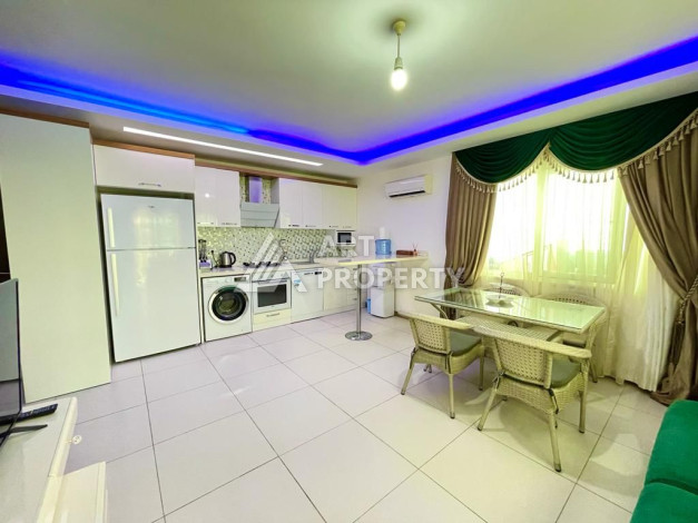 Просторные апартаменты планировки 1+1 в районе Махмутлар, 75 м2 - Ракурс 7