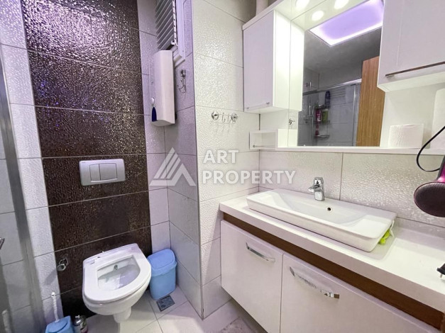 Просторные апартаменты планировки 1+1 в районе Махмутлар, 75 м2 - Ракурс 21